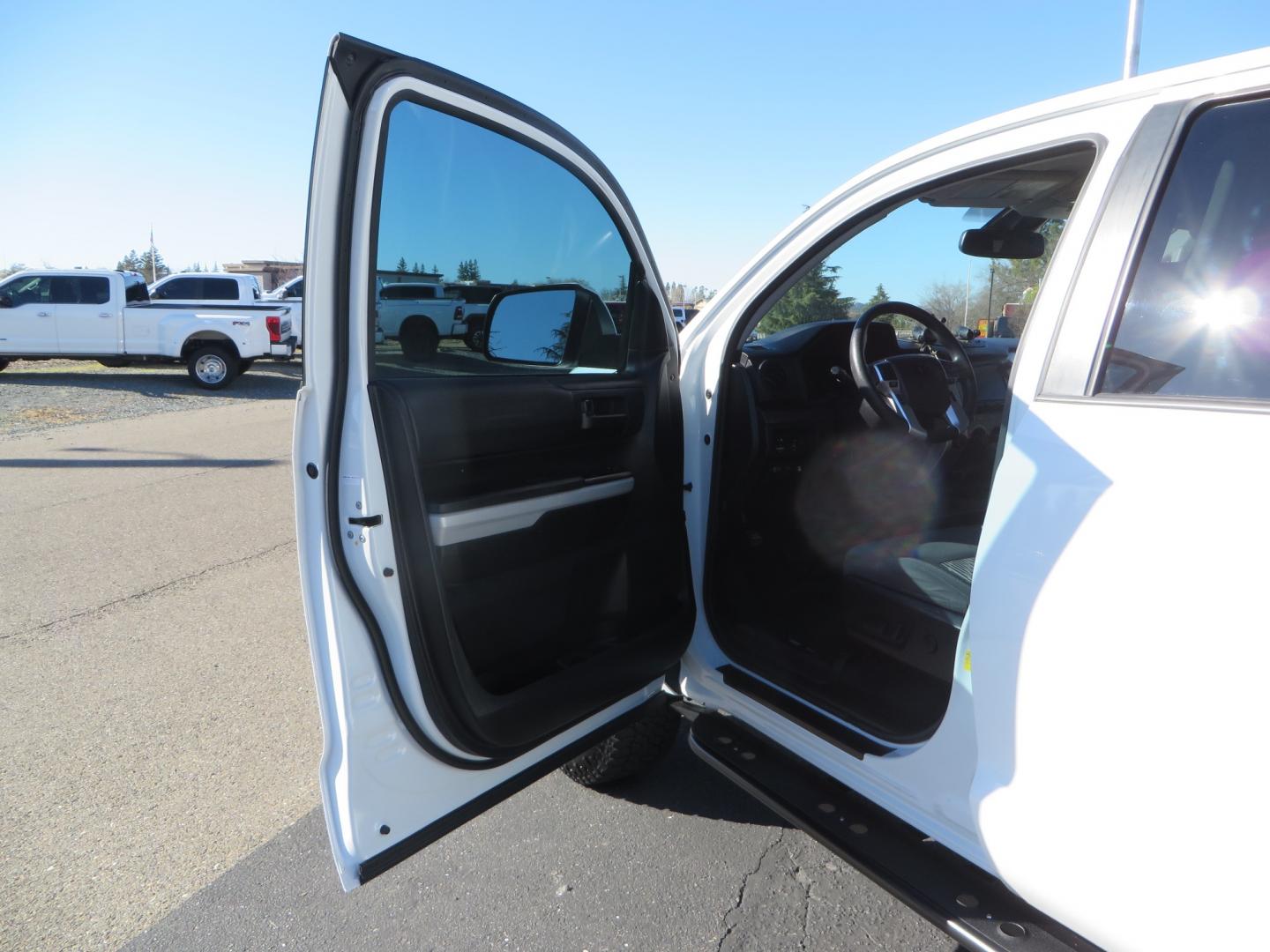 2020 White /GREY Toyota Tundra SR5 (5TFDY5F19LX) with an 5.7L engine, automatic transmission, located at 2630 Grass Valley Highway, Auburn, CA, 95603, (530) 508-5100, 38.937893, -121.095482 - Features - King Off Road adjustable remote reservoir coil overs, King 2.5 adjustable remote reservoir rear shocks, Method Race wheels, Falken Wildpeak tires, Sliders, Bed braces, Borla Exhaust, Husky floor mats, Window tint, and Ram phone mounts. - Photo#14